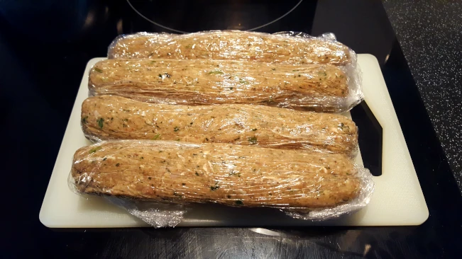 raw kebabs in cling film