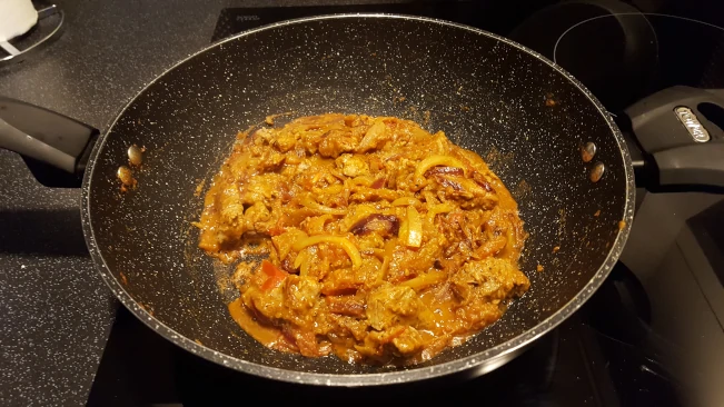 beef added to the mixture in a pan beef added to pan