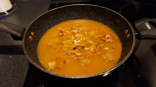 water added to the mixture in a pan water added to pan