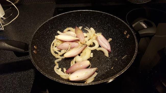 shallots & onions for beef and mushroom pie filling in a pan shallots onions in pan