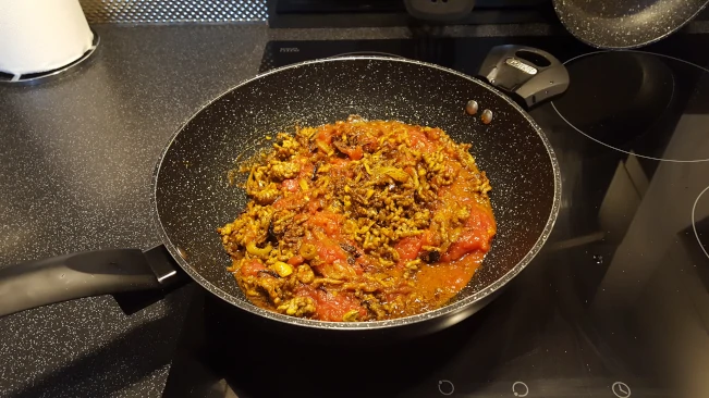 tomatoes added to the mince, onions & spices tomatoes added to pan