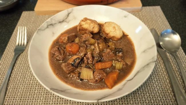 cooked beef stew and dumplings