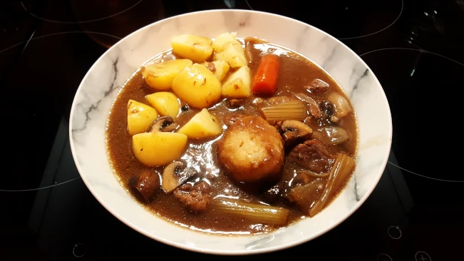 beef stew and dumplings served with potatoes beef stew and dumplings with potatoes saved