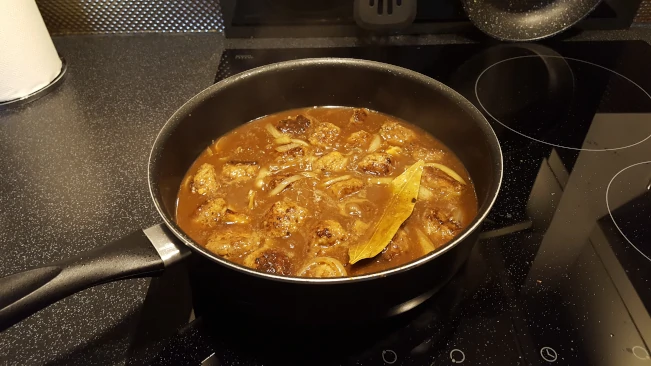 meatballs simmering meatballs simmering