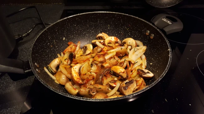 tomato-puree-stirred-in-to-onions-and-mushrooms