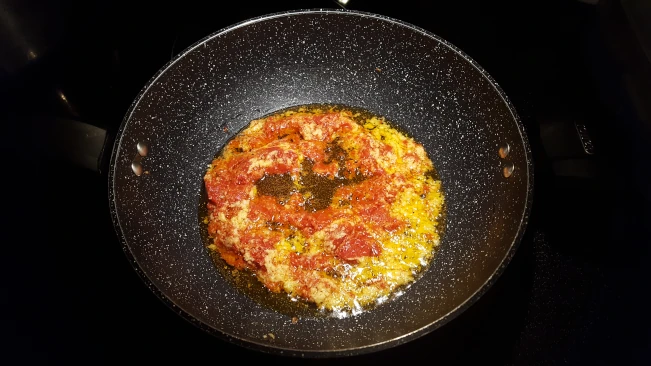 tomato puree in melted ghee for butter chicken tomato puree in melted ghee