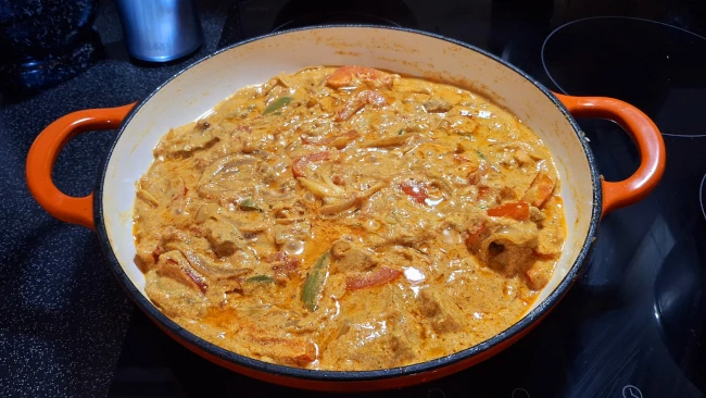 caribbean creamy pork curry in pan