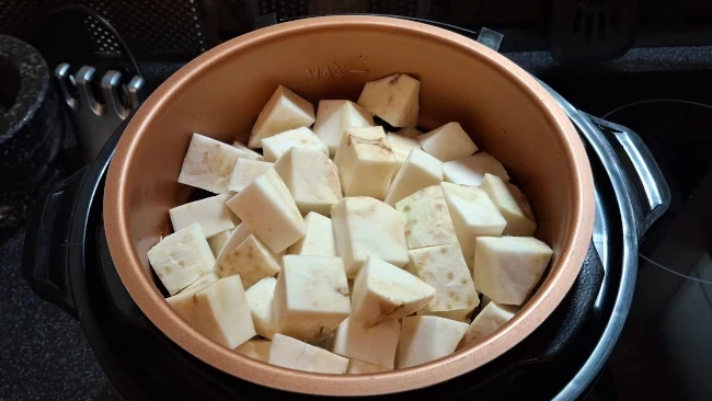 diced celeriac in a cooking pot