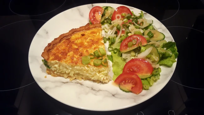 cheese and onion quiche and salad