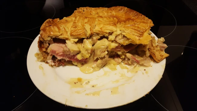 chicken & gammon pie broken on a plate for serving broken chicken & gammon pie