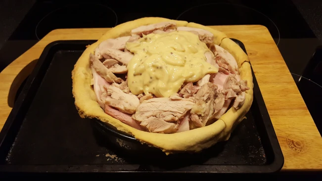 sauce added as the final layer of the pie pastry base filling 7