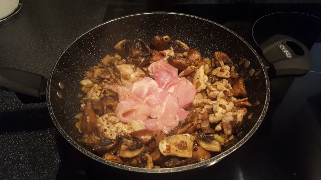 chicken added to pan for chicken in creamy peppercorn sauce chicken added to pan