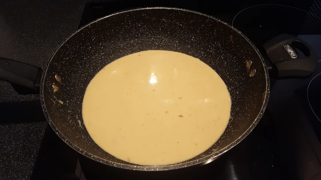 milk added to roux for chicken in creamy peppercorn sauce milk added to roux