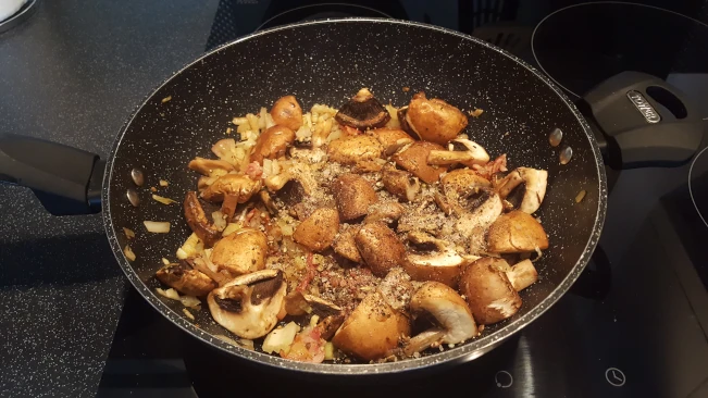 mushrooms added to pan for chicken in creamy peppercorn sauce mushrooms added to pan
