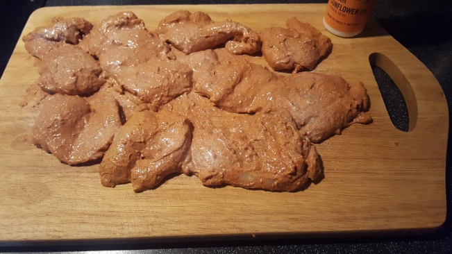 marinated chicken on a board