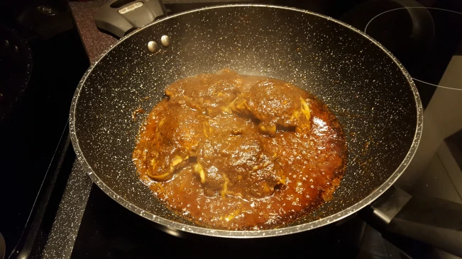 chicken cooking in wok
