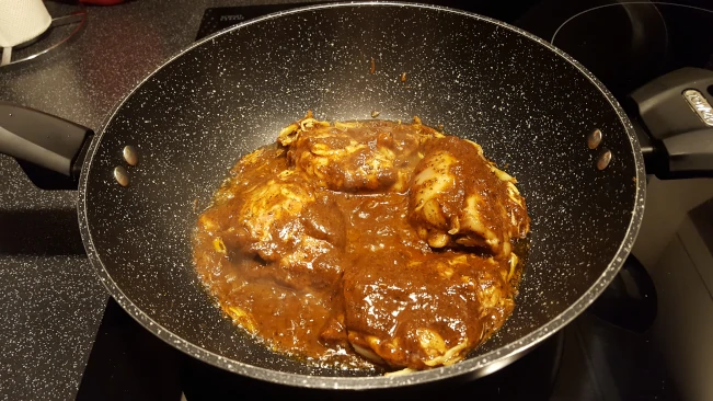 marinated chicken in wok