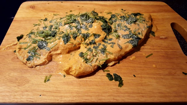 marinated chicken on a board
