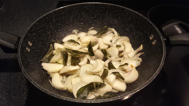 onions and curry leaves frying