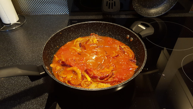 tomatoes stirred in pan