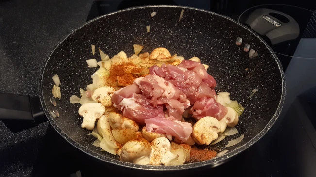 chicken added to wok for chinese chicken curry chicken added to wok