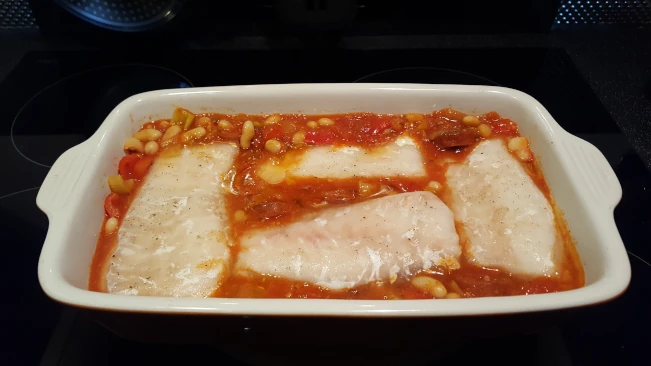 cod fillets added to baking dish 01