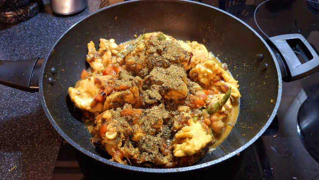 curry leaf masala added to pan for curry leaf masala chicken fry curry leaf masala added to pan