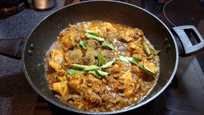 curry leaf masala added to pan for the 3rd time for curry leaf masala chicken fry curry leaf masala added to pan 03