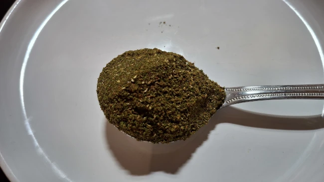 curry leaf masala on a spoon for curry leaf masala chicken fry curry leaf masala spoon