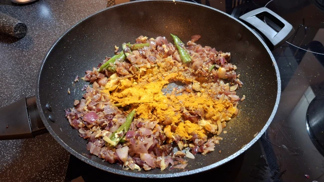 ground spices added to pan for curry leaf masala chicken fry ground spices added to pan