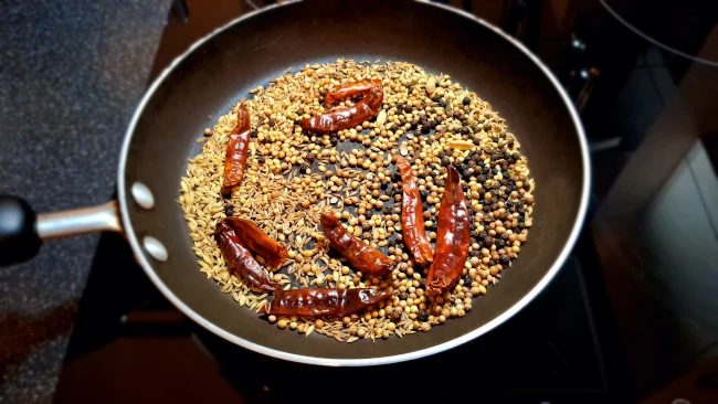 toasting whole spices in a pan for curry leaf masala chicken fry toasting whole spices in a pan