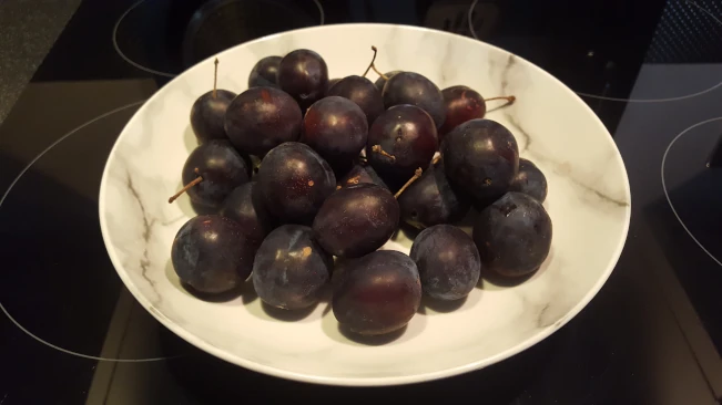 ingredients for damson and soured ceam tart on a board ingredients on a board