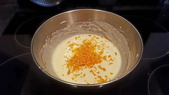 flan filling and orange zest in a bowl for damson and soured ceam tart flan filling and orange zest in a bowl