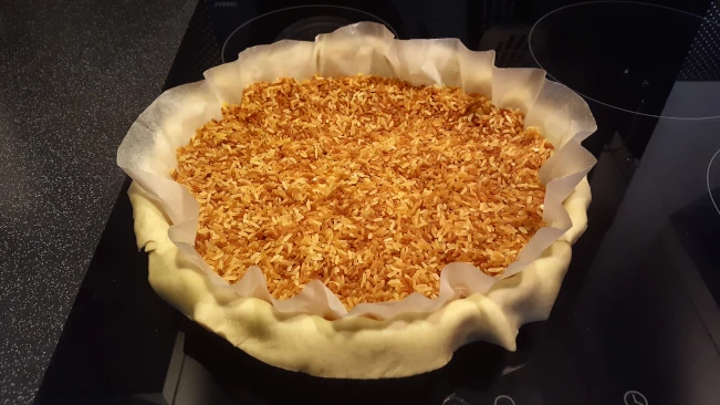 pastry and rice in a flan dish for damson and soured ceam tart pastry and rice in a flan dish