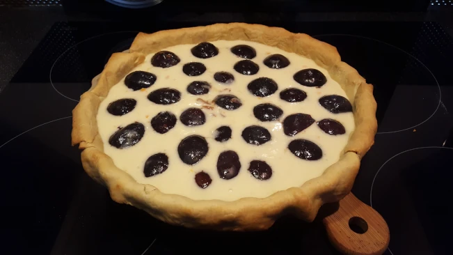 tart filling topped with damsons for damson and soured ceam tart tart filling topped with damsons