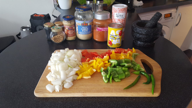 onions & peppers on a board