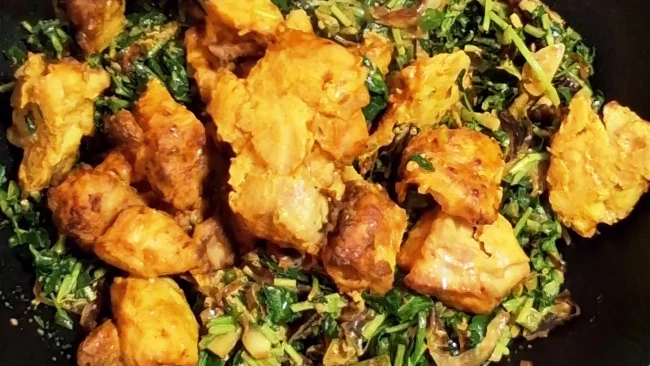 grilled chicken pieces added to pan