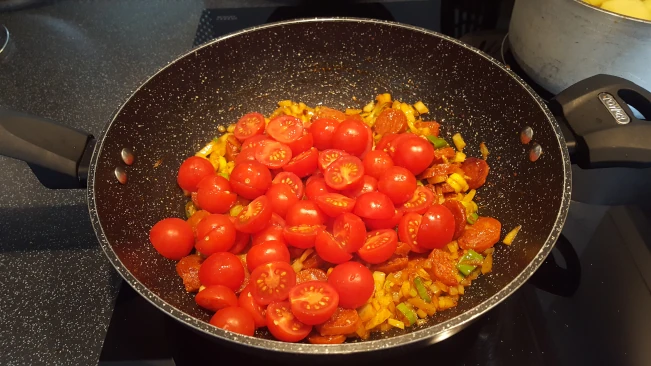 cherry tomatoes added to pan
