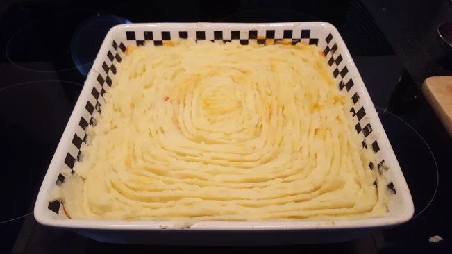 fish and chorizo pie topped with potato