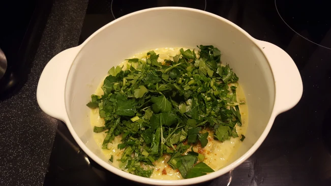 leeks in sauce for mum's fish pie parsley added to sauce