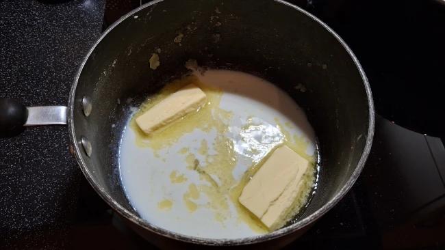 butter melting in milk for fluffy mashed potatoes butter melting in milk
