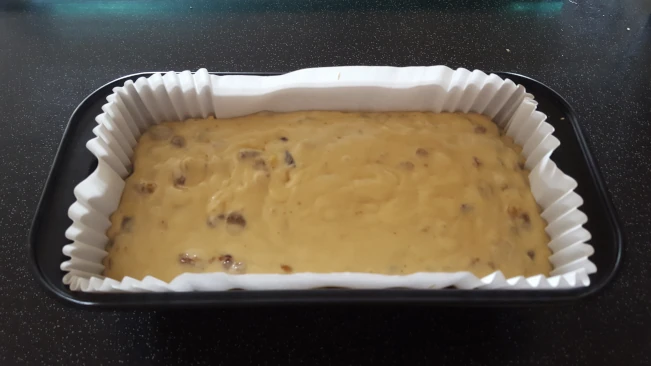 fruit cake mix in a lined loaf tin fruit cake mix in a lined loaf tin