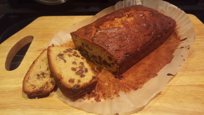 Freshly baked fruit cake sliced on a chopping board fruit cake sliced 02