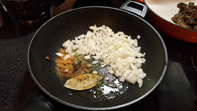 onions and thyme added for jamaican beef & butter bean curry onions and thyme added