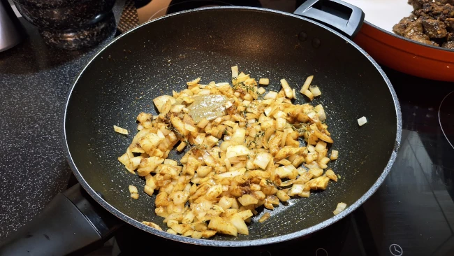 onions lightly browned for jamaican beef & butter bean curry onions lightly browned