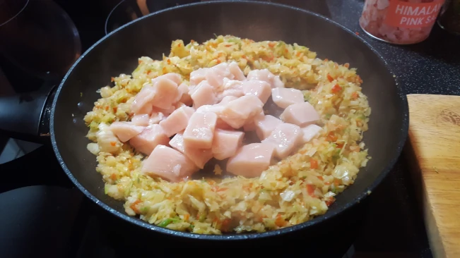 sealing diced chicken with veg for Jamaican Pumpkin Soup sealing diced chicken with veg