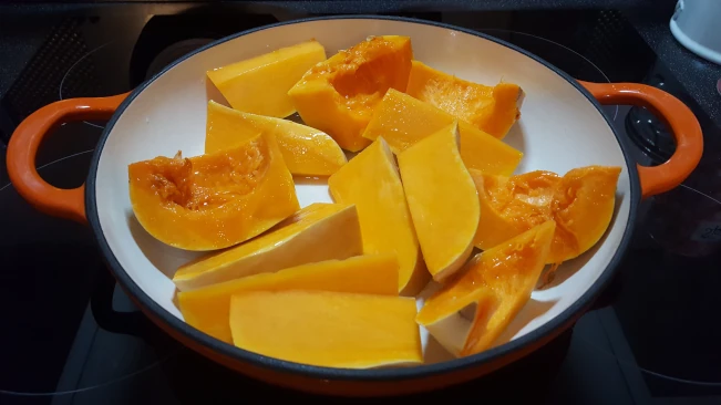 sliced pumpkin in oven dish for Jamaican Pumpkin Soup sliced pumpkin in oven dish