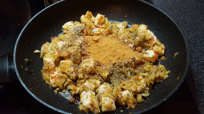 spices added to chicken and veg for Jamaican Pumpkin Soup spices added to chicken and veg