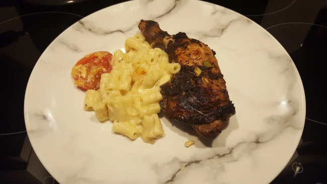 jerk chicken amcaroni pie plated