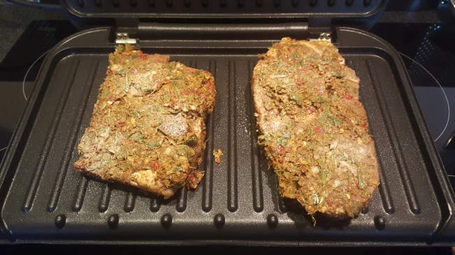 jerked pork steaks grilling